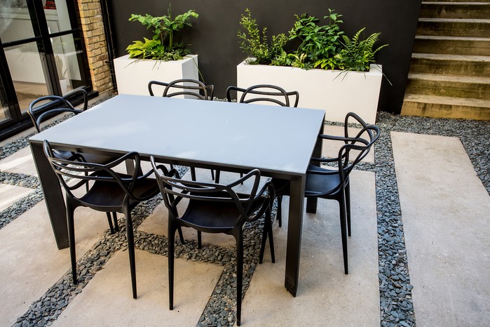 Long paving stones placed horizontally across the patio