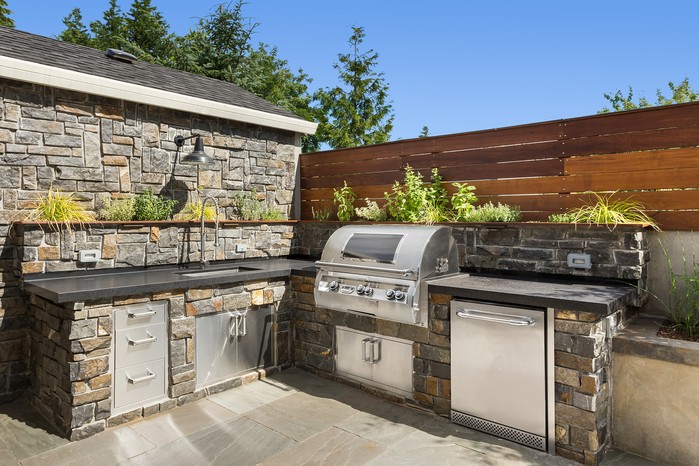 Outdoor kitchen with fridge. Getty Images