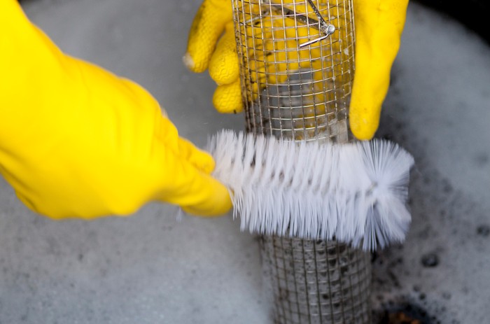 Cleaning a bird feeder